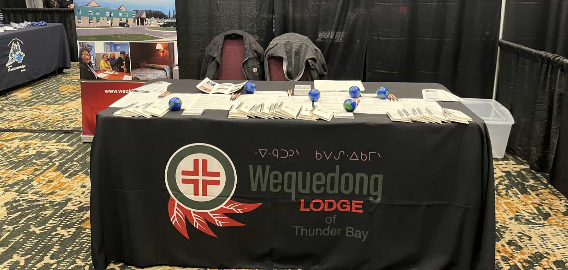 Wequedong Lodge table at a career fair